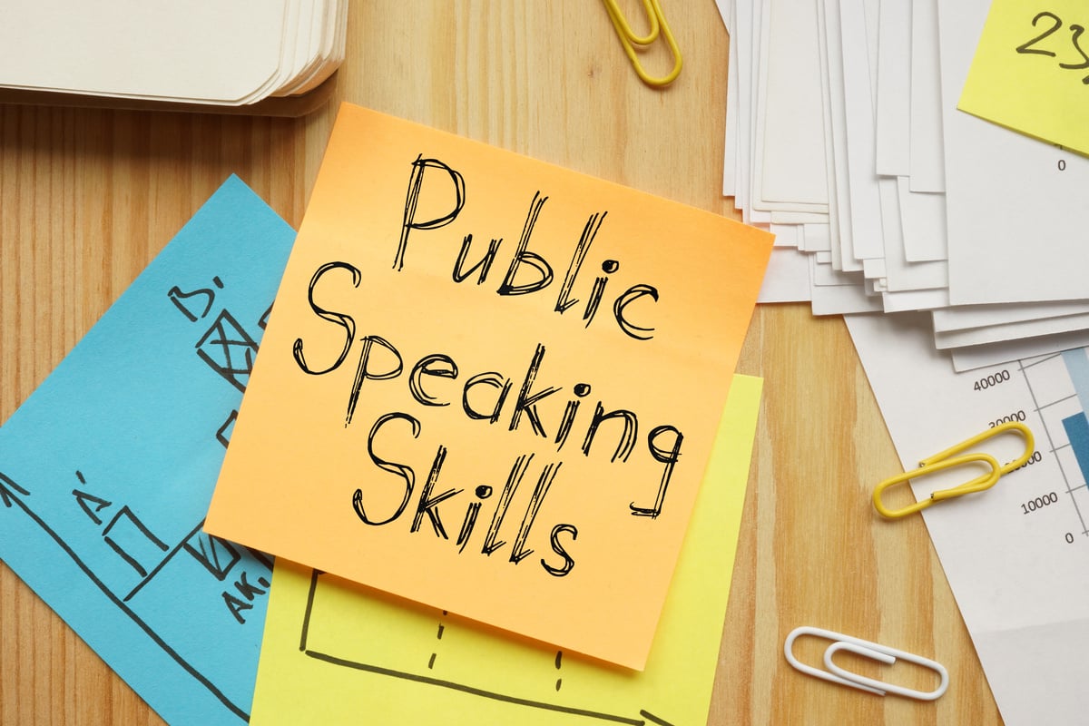 Public Speaking Skills is shown on the conceptual business photo